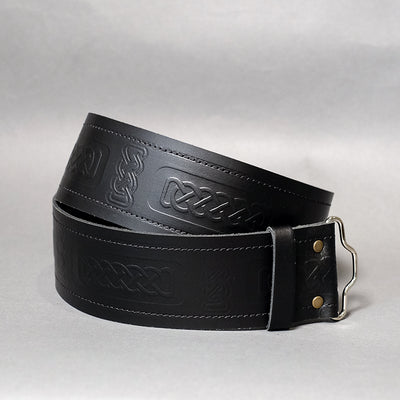 Embossed thick black leather kilt belt with celtic design and adjustable velcro fastening. 